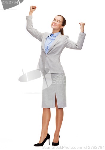 Image of happy businesswoman with hands up