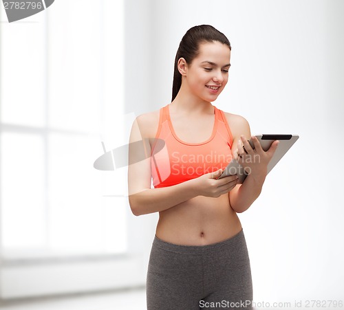 Image of sporty woman with tablet pc computer