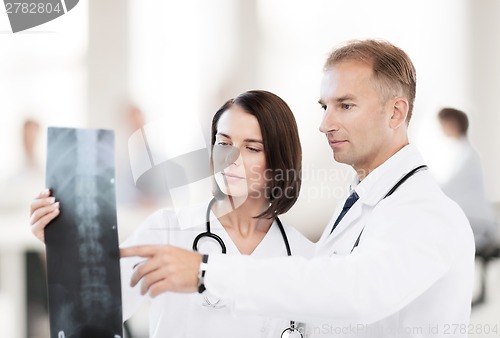 Image of two doctors looking at x-ray