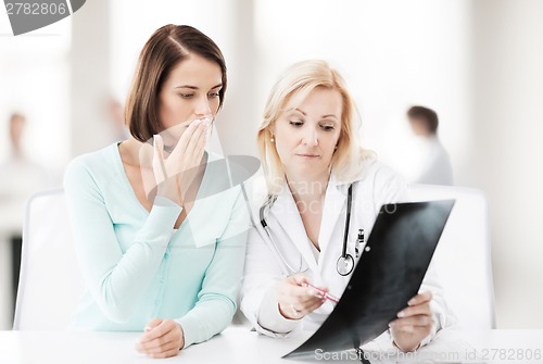 Image of doctor with patient looking at x-ray