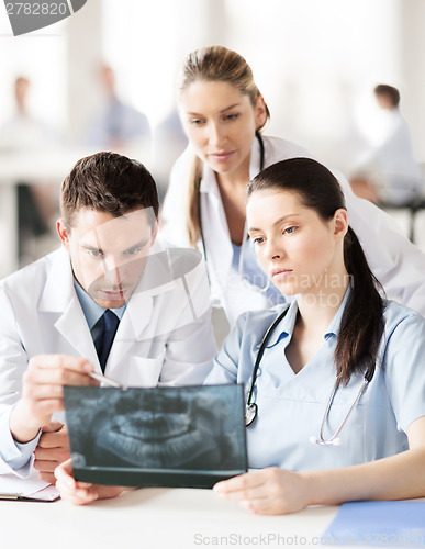 Image of group of doctors looking at x-ray