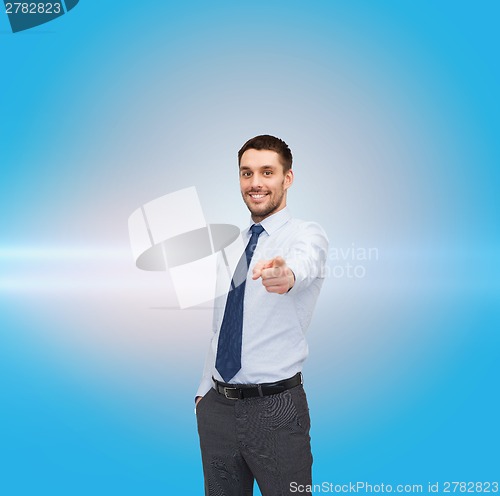 Image of handsome businessman pointing finger at you