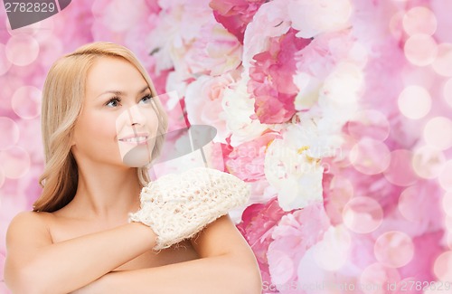 Image of smiling woman with exfoliation glove