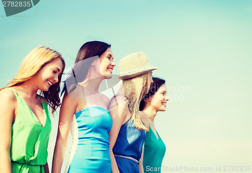 Image of girls walking on the beach