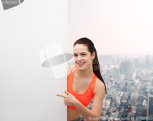 Image of teenage girl in sportswear with white board