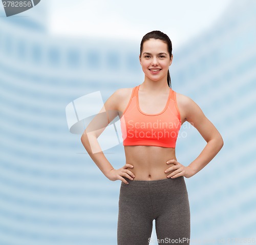 Image of smiling teenage girl in sportswear