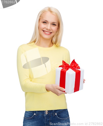 Image of smiling girl with gift box