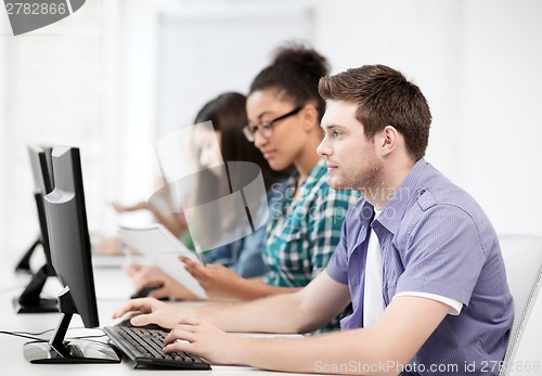 Image of students with computers studying at school