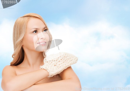 Image of smiling woman with exfoliation glove