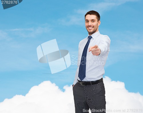 Image of handsome businessman pointing finger at you