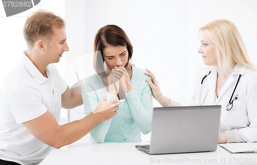 Image of doctor with patients in hospital