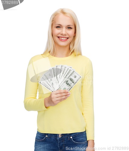 Image of smiling girl with dollar cash money