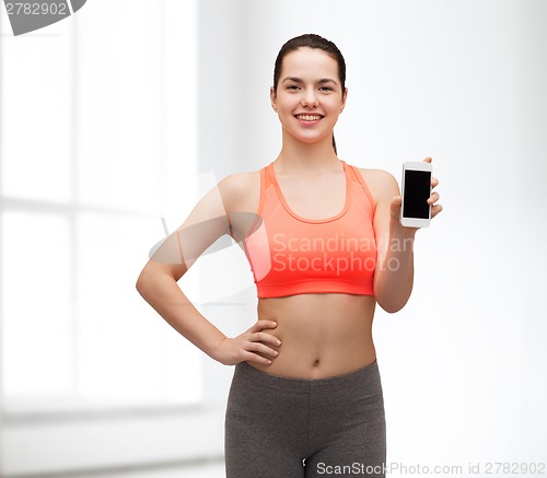Image of sporty woman with smartphone
