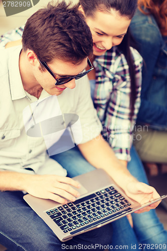 Image of students or teenagers with laptop computer