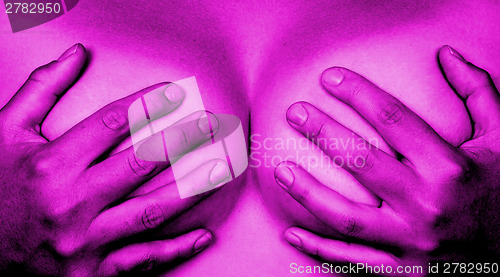 Image of Hands covering breasts