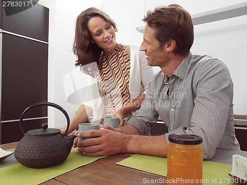 Image of couple &  kitchen