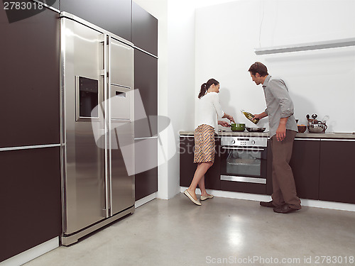 Image of couple in the kitchen aln