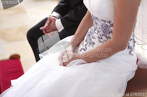 Image of Hands of a bride and groom