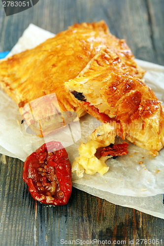Image of Puff pastry with cheese and sun-dried tomato.
