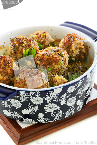 Image of Meatballs in blue ceramic pot.