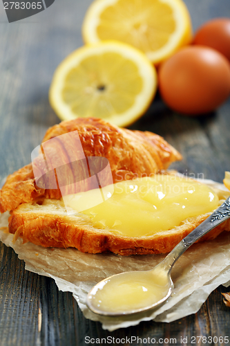 Image of Lemon curd on a slice of fresh croissant.  