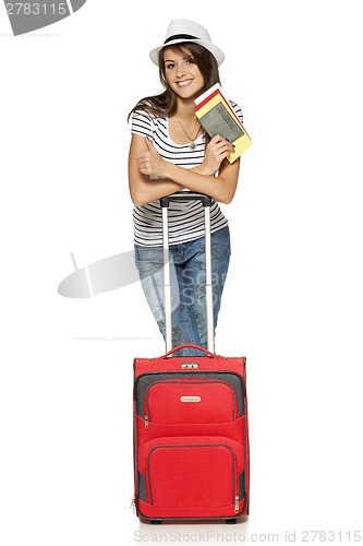 Image of Female in casual standing with travel suitcase