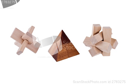 Image of Wooden brain teasers on white background 