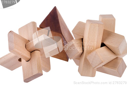 Image of Wooden brain teasers on white background 