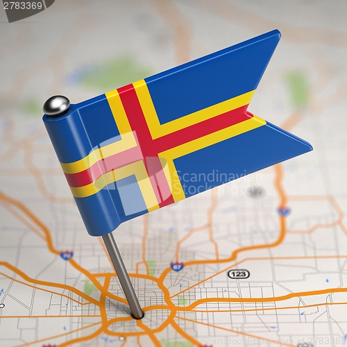 Image of Aland Islands Small Flag on a Map Background.