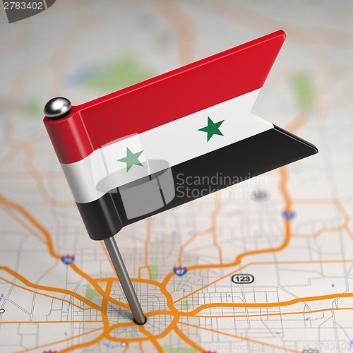 Image of Syria Small Flag on a Map Background.