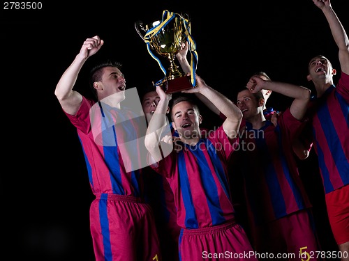 Image of soccer players celebrating victory