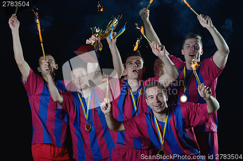 Image of soccer players celebrating victory