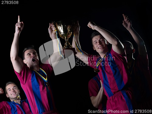 Image of soccer players celebrating victory