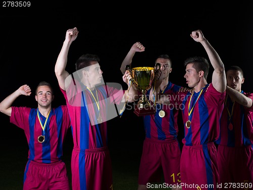 Image of soccer players celebrating victory