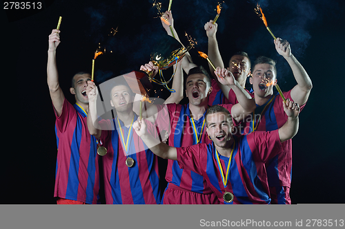 Image of soccer players celebrating victory