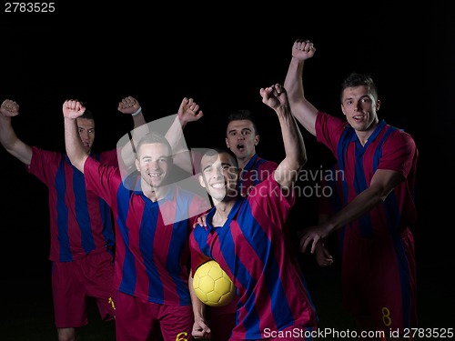 Image of soccer players celebrating victory