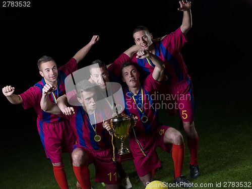 Image of soccer players celebrating victory