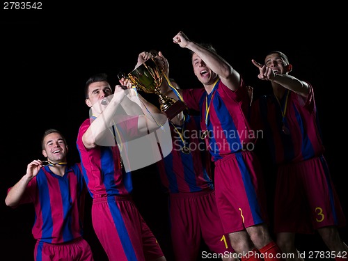 Image of soccer players celebrating victory