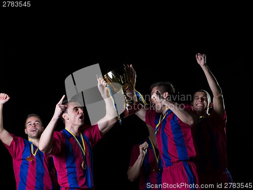 Image of soccer players celebrating victory