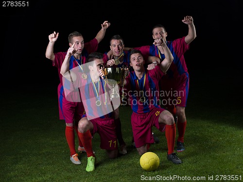 Image of soccer players celebrating victory