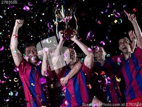 Image of soccer players celebrating victory