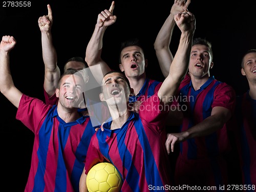 Image of soccer players celebrating victory