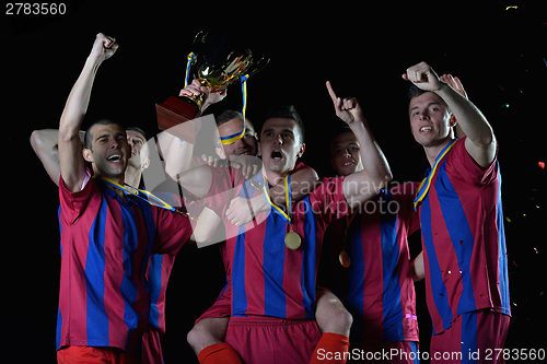 Image of soccer players celebrating victory