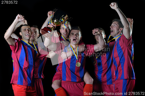 Image of soccer players celebrating victory