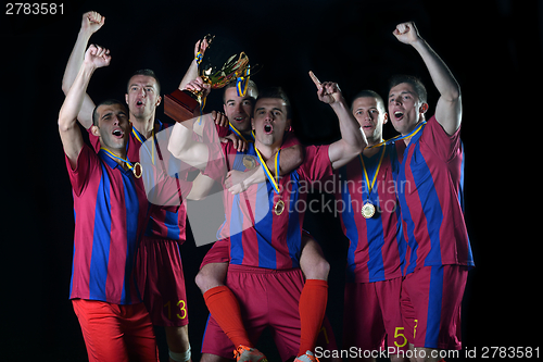 Image of soccer players celebrating victory