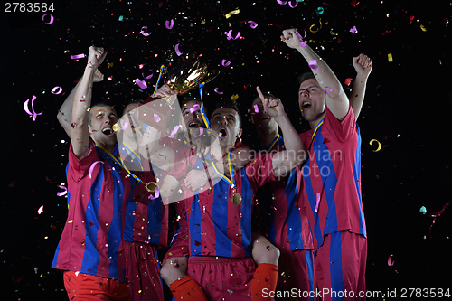 Image of soccer players celebrating victory