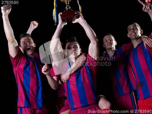 Image of soccer players celebrating victory