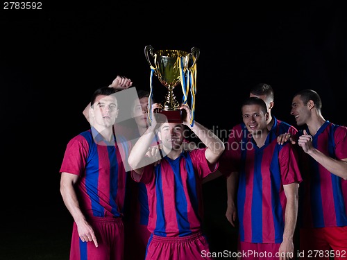 Image of soccer players celebrating victory