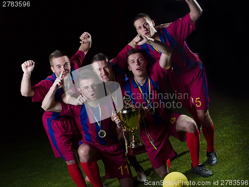 Image of soccer players celebrating victory