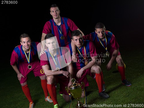 Image of soccer players celebrating victory